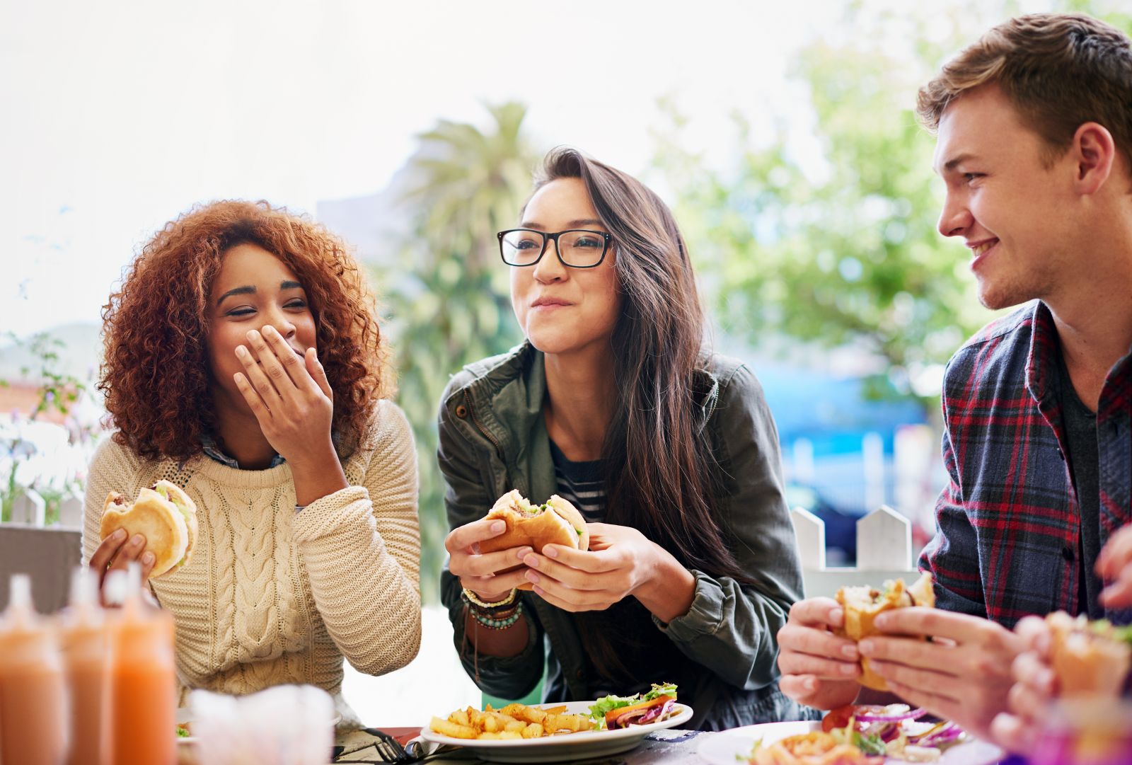 People eating, laughing, and socializing