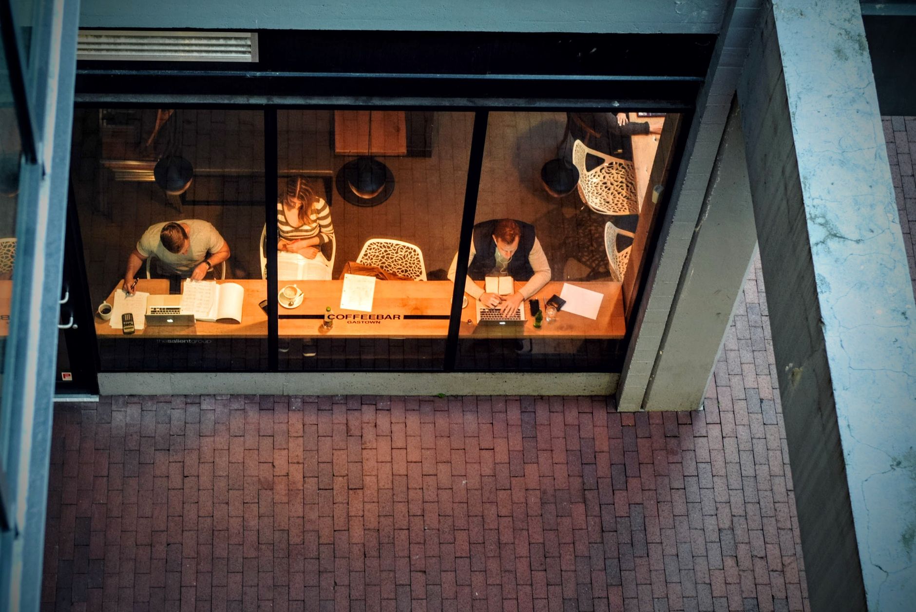 Student studying on a laptop at a quiet Houston coffee shop with natural light